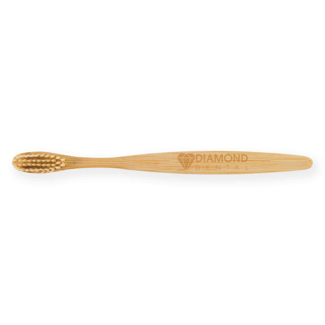 A bamboo toothbrush featuring a sleek design, with a logo engraved on the handle.