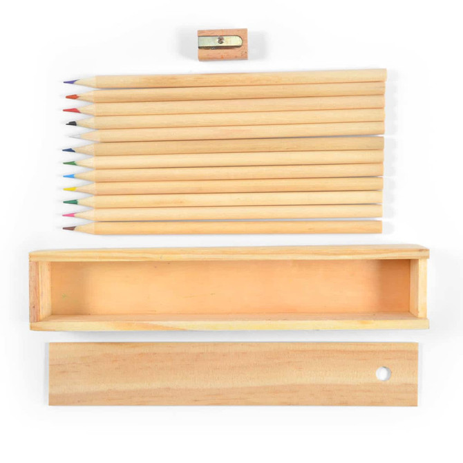 A set of wooden colored pencils in various colors with a small sharpener, presented in a wooden case.