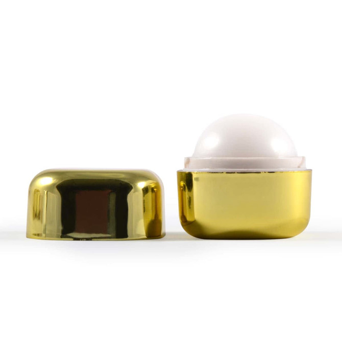 A gold container of Ritz Cube Lip Balm with a white balm inside, showcasing a sleek, shiny design.