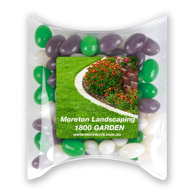 A pillow pack containing green, purple, and white jelly beans with a promotional label.