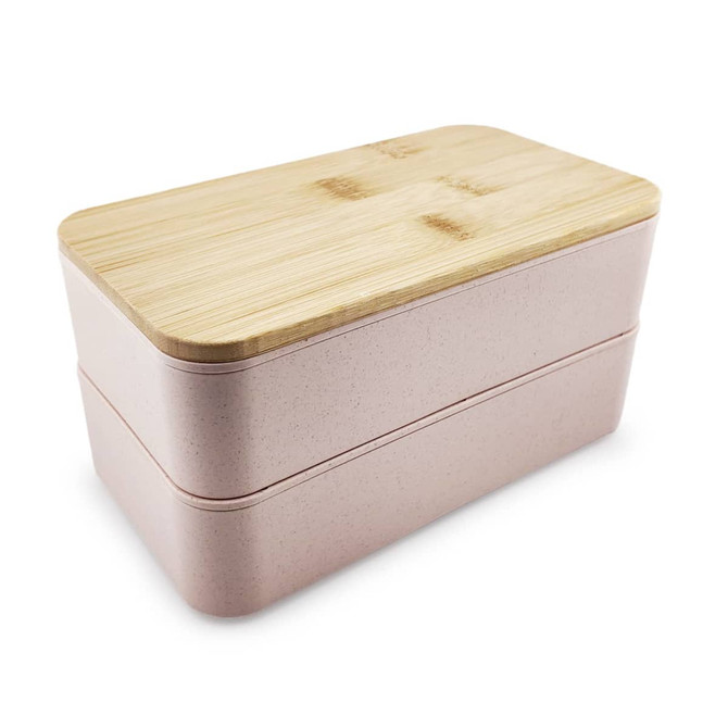 A pink two-tier lunch box with a bamboo lid and a smooth finish, featuring a logo on the side.