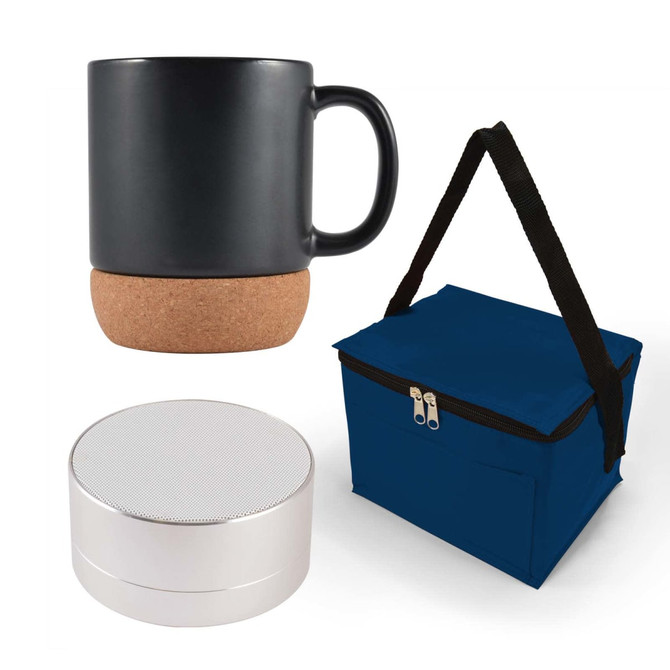 A coffee mug with a cork base, a round portable speaker, and a navy blue insulated bag.