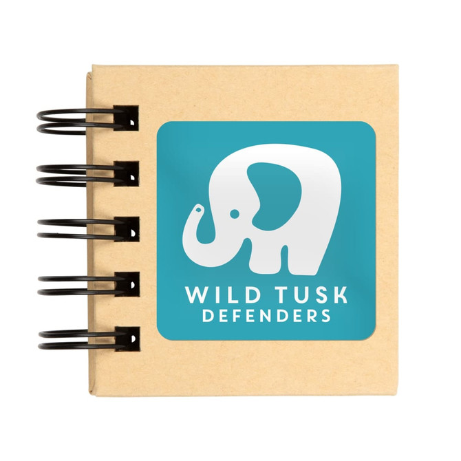 A tan sticky note pad with a spiral binding featuring an elephant logo on a turquoise background.
