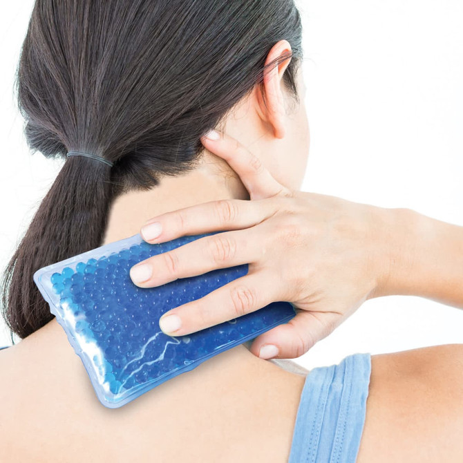 A Yoga Gel Bead Hot & Cold Pack is being applied to the neck area.