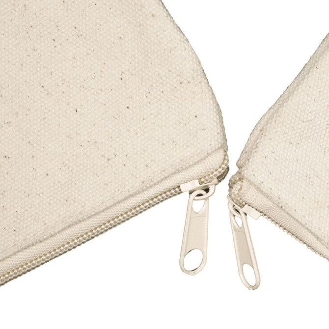 A beige canvas tote bag with a textured surface and two zippered compartments.