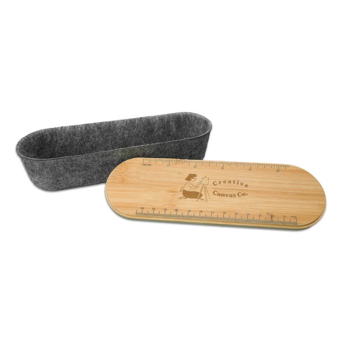 A Mansfield Utility Case featuring a felt container and a bamboo lid with a ruler design.