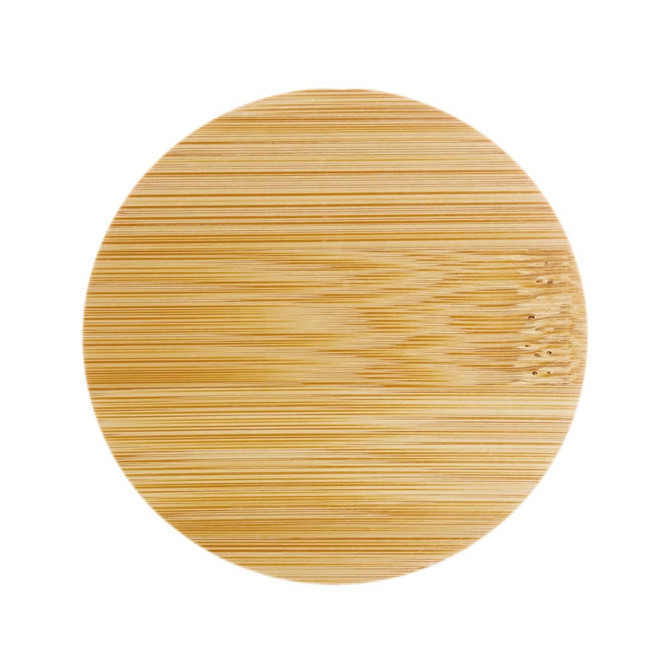 A round bamboo serving board featuring a smooth, natural finish.