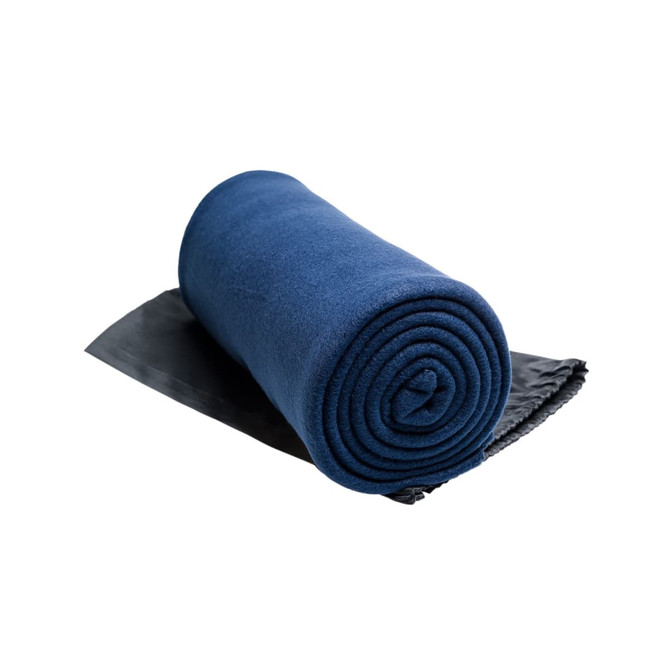 A rolled Polar Blanket in a deep blue color, positioned on a dark gray surface.