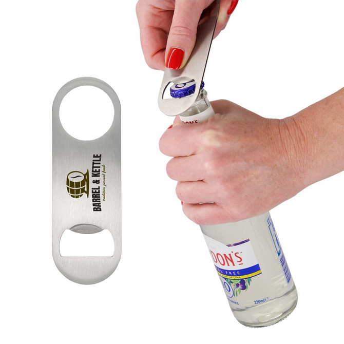 A drink bottle opener in silver is being used to open a bottle. It features a logo on the side.