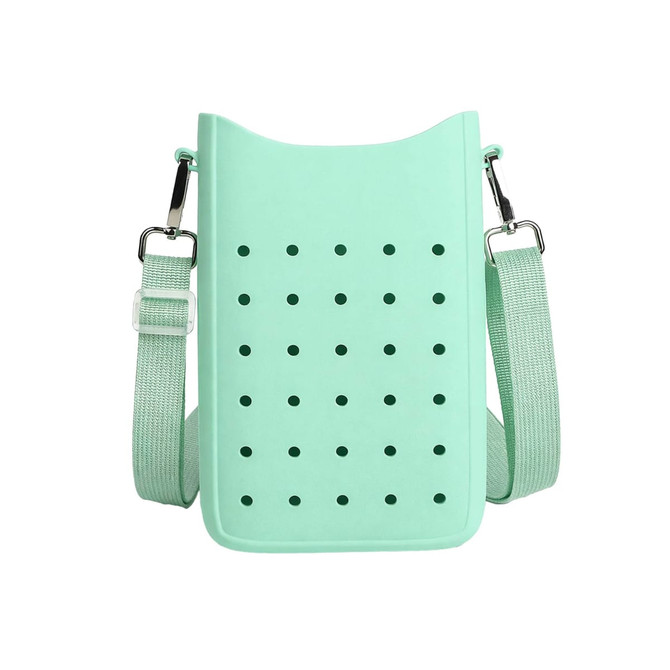 A mint green silicone phone bag with holes and adjustable straps, featuring a simple, minimalist design.