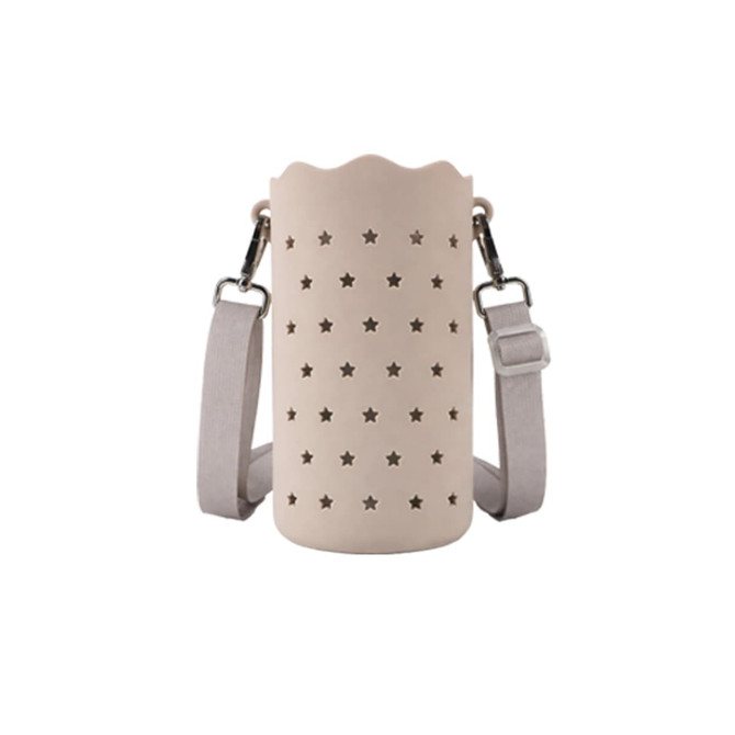 A drink bottle bag in soft beige silicone with star cut-outs and an adjustable strap. It features a logo.