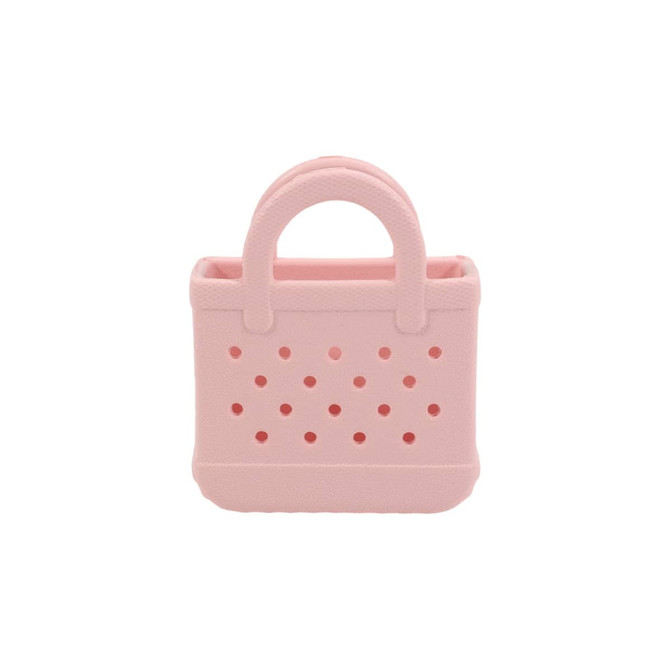 A pink mini EVA bag charm with perforated design and a handle, featuring a small opening at the top.