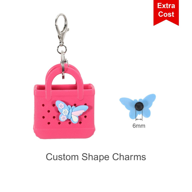 A pink mini EVA bag keychain with a blue butterfly charm attached, featuring a silver clip for easy attachment.