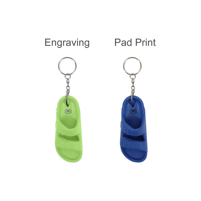 A green and a blue slide-shaped keyring with a metal keychain, featuring a logo on each.