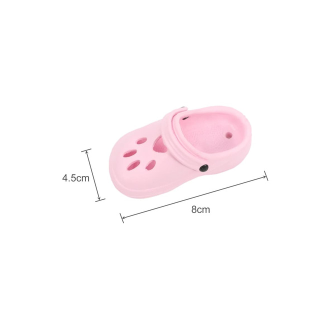 A pink paw shape clog shoe fridge magnet, measuring 8cm by 4.5cm, featuring vent holes and a strap.