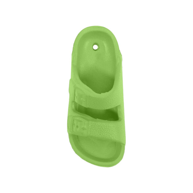 A bright green fridge magnet shaped like a sandal, featuring two straps and a hole at the top.