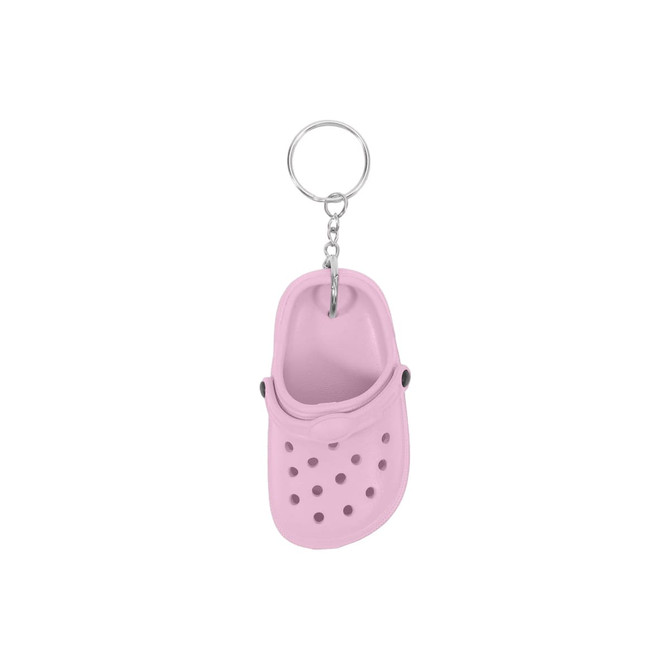A pink clog shoe keyring features detailing like holes and a strap, attached to a metal chain. It has a logo.