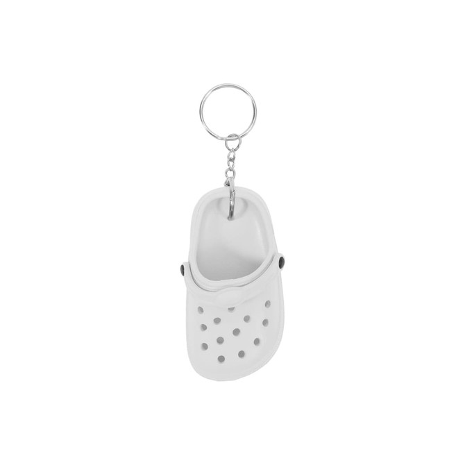 A white clog shoe keyring with black accents, attached to a silver keychain.