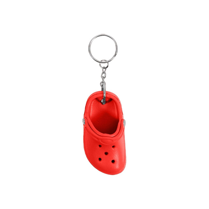 A red clog shoe keyring with a silver metal chain and a keyring attachment.