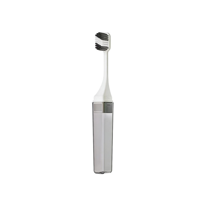 A square, foldable handle toothbrush in white and grey, housed in a sleek storage case with a logo.