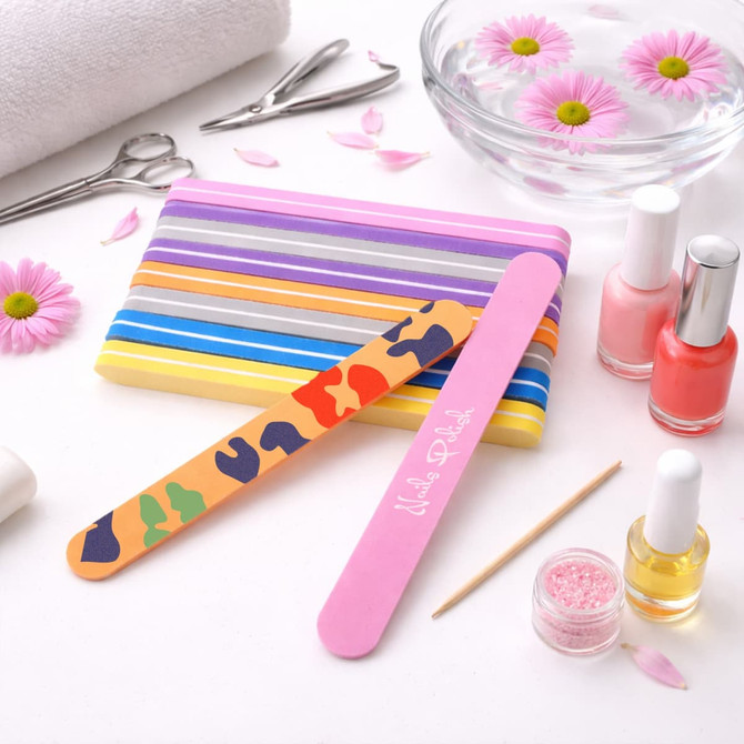 A set of nail files in various colours, featuring a pink file with a logo and a multicoloured camouflage design file.