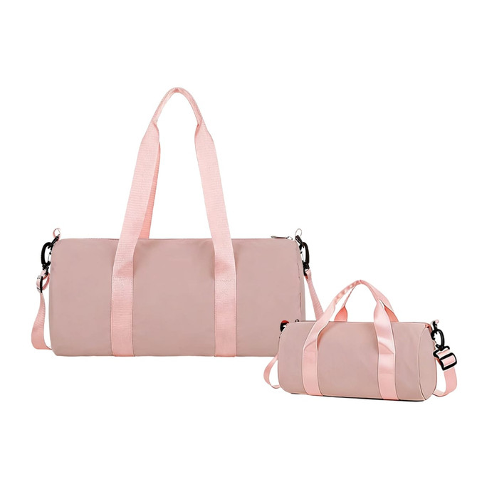 A pink bucket duffle bag with wide straps, featuring a large bag and a smaller matching bag.
