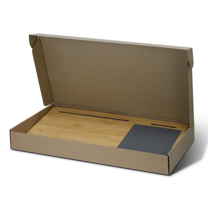 A bamboo lap desk in a cardboard box, featuring a sleek grey section and a smooth bamboo surface.