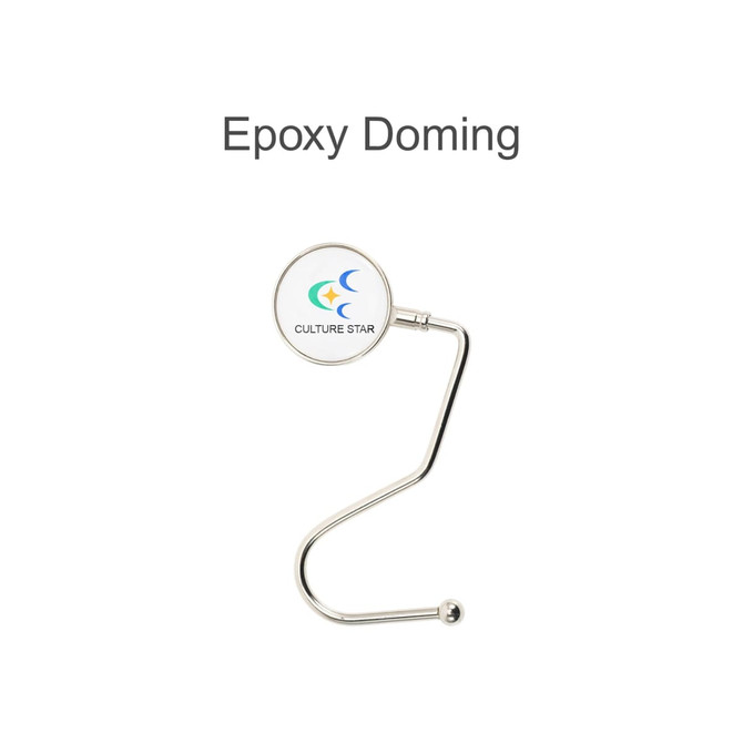 A round, curved desk hook in silver with a circular top featuring a logo.