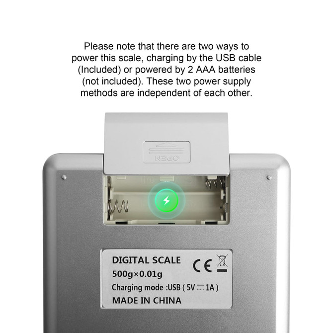 A rechargeable kitchen scale in silver with a green indicator light, featuring a USB charging port and battery compartment.