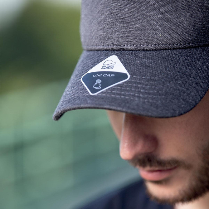 A grey cap with a logo, featuring a structured brim and an adjustable strap at the back.