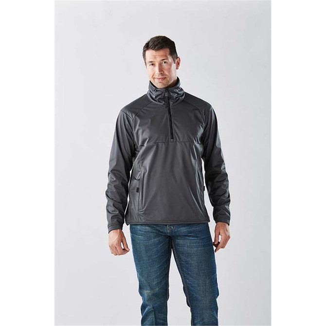 A man wearing a grey Men's Catskill Anorak jacket, standing confidently against a light background.