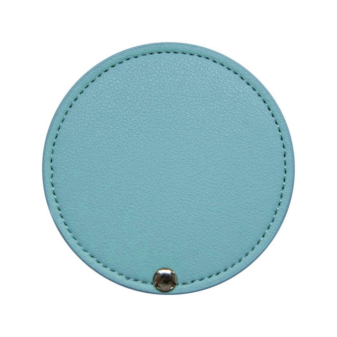 A round makeup mirror in a light blue colour with a stitched edge and a small metallic button.