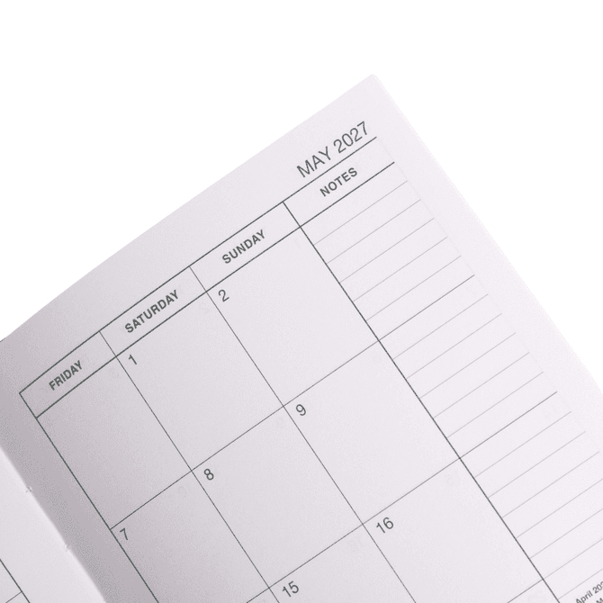 An open A5 diary featuring a monthly layout for May 2027, with blank spaces for each day and notes.