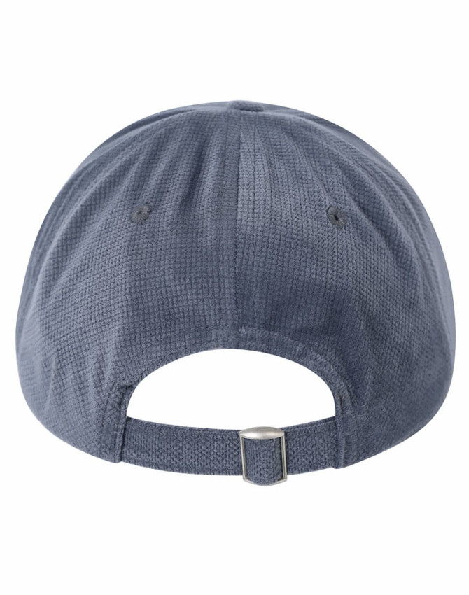 A navy blue 5 panel cap with a jacquard texture and an adjustable strap at the back. Features a logo.