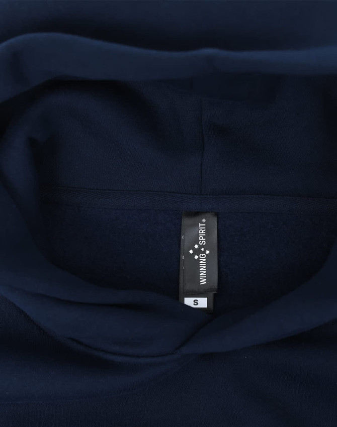 A navy oversized hoodie featuring a fleece interior and a label inside the collar.