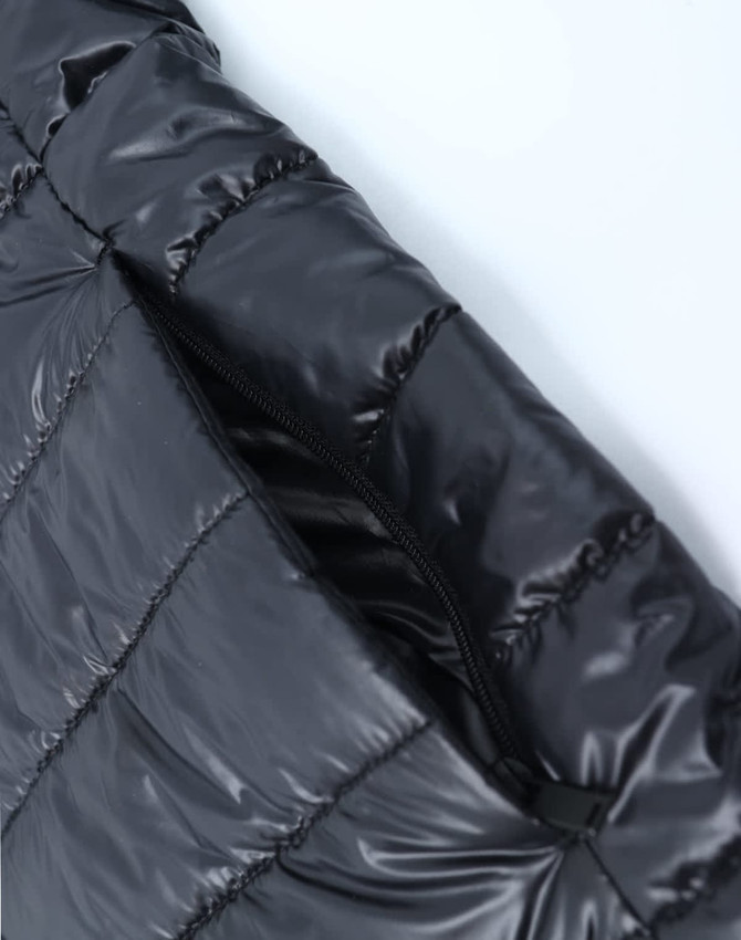A black lightweight hooded puffer jacket with a zip closure and quilted design. It features a logo on the fabric.