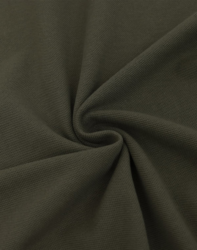 A textured fabric in a rich olive green colour, showcasing a smooth, pique weave pattern.