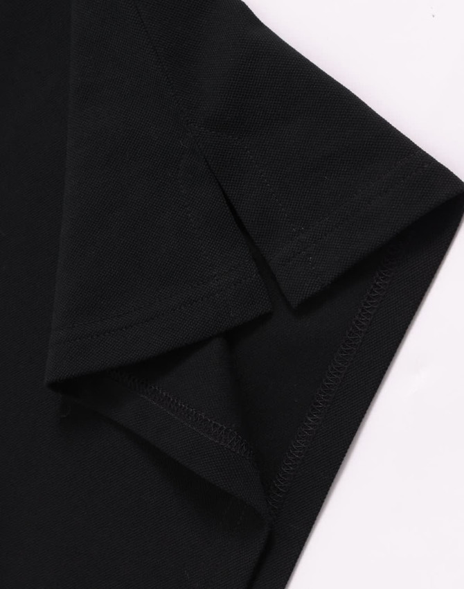 A black men's ultrafine cotton pique polo highlighting the sleeve details and stitching. Features a logo.