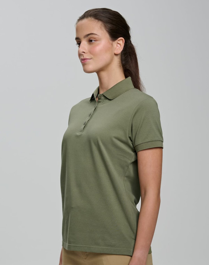 A woman wearing an olive green ultrafine cotton pique polo with a classic collar and short sleeves.