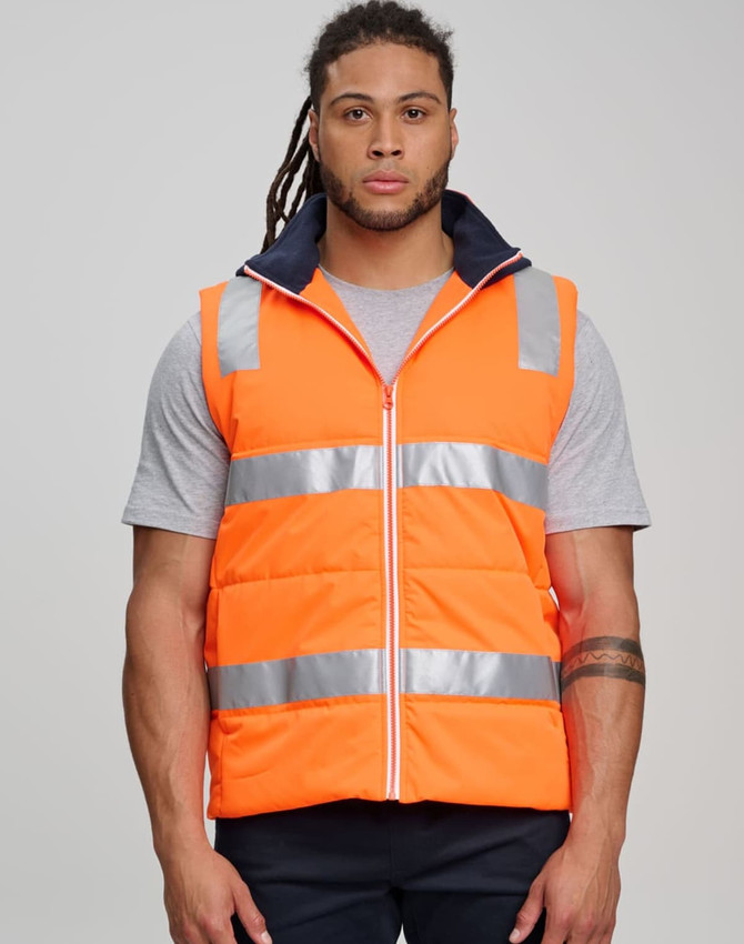 Unisex hi vis hooded puffer vest in bright orange with reflective strips, featuring a zipped front and navy collar.