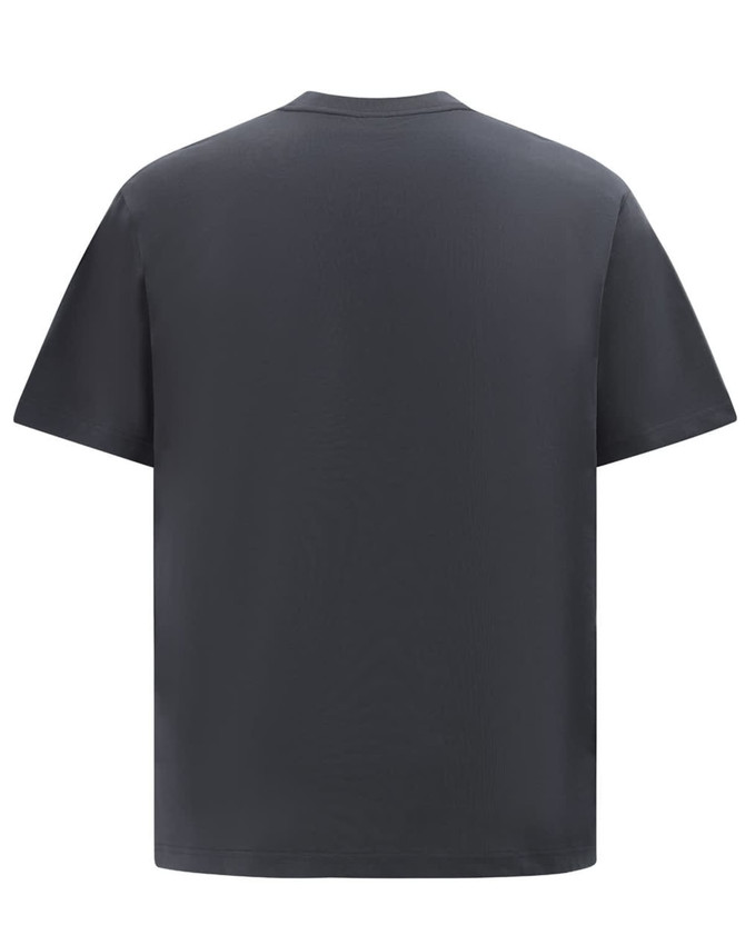 A heavy cotton oversized tee in dark grey, featuring a simple design and a relaxed fit. The garment has a logo.
