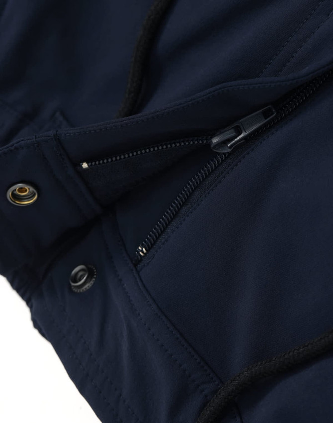 Navy blue DWR water repellent flexi work pants with zippered and buttoned closures, featuring a logo.