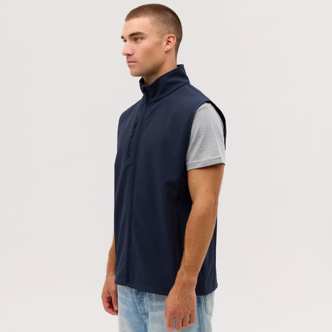 A navy blue softshell vest with a zippered front and high collar, displayed on a model.