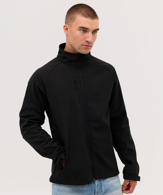 A black softshell jacket with a zippered front and a high collar, worn by a model.