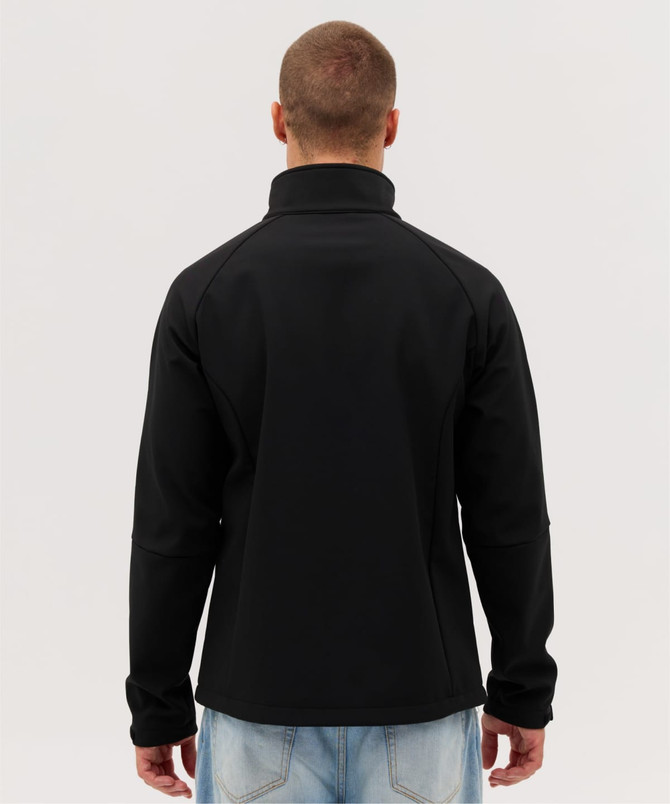 A black Prime Softshell Jacket is displayed from the back, featuring a high collar and a fitted design.