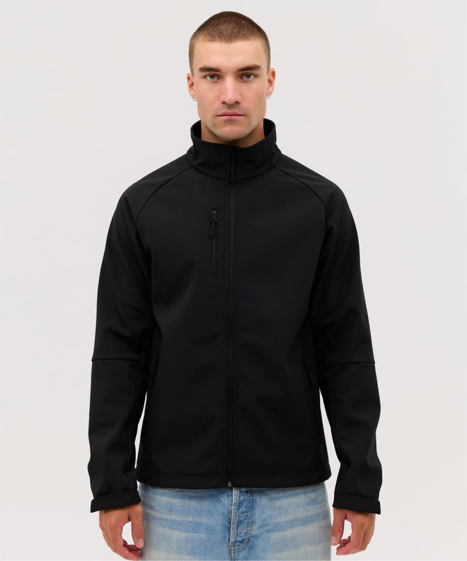 A black softshell jacket with a high collar, featuring a zip pocket and a fitted design.