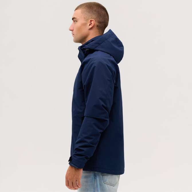 A navy blue utility jacket displayed on a model from the side, featuring a hood and a sleek design.