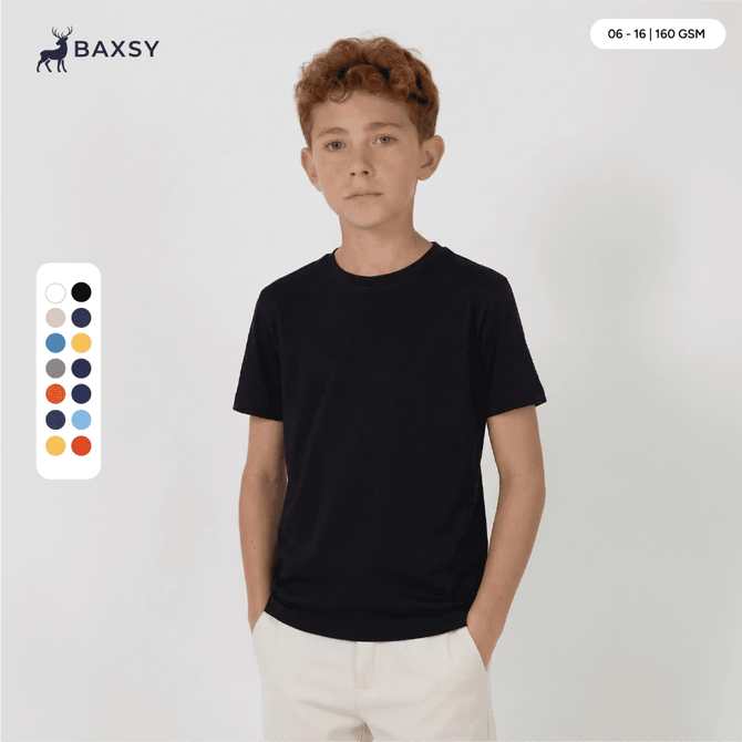 A youth black core tee displayed on a model, featuring a round neck and short sleeves, with a logo present.
