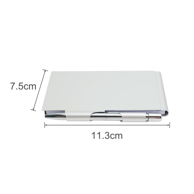 An aluminium pocket notebook in silver with dimensions of 11.3 cm by 7.5 cm, featuring a pen.