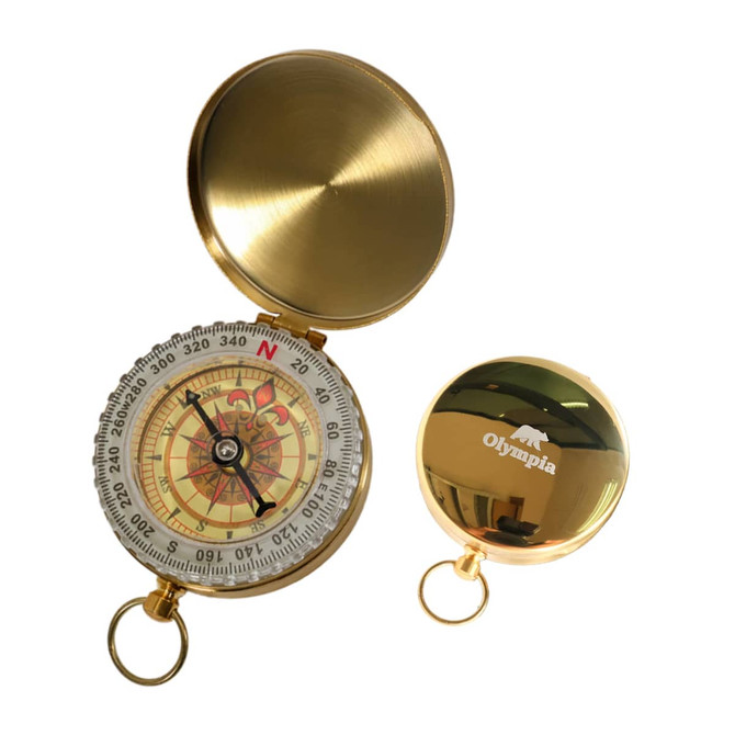 A golden compass with a decorative dial and a logo on the lid, featuring a keychain attachment.